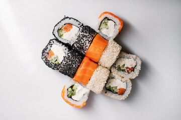 Sushi set with salmon, tuna and cream cheese close-up. Traditional Japanese cuisine.