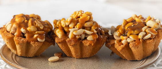 Peanut tart covered with salted caramel sauce