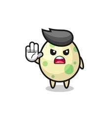 spotted egg character doing stop gesture