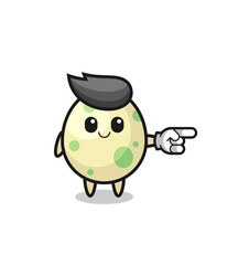 spotted egg mascot with pointing right gesture