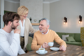Parents happy to see their son, family looking happy