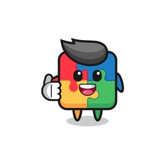 puzzle mascot doing thumbs up gesture