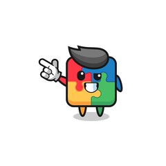 puzzle mascot pointing top left