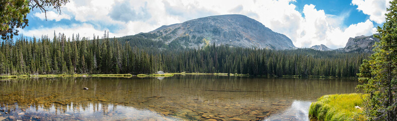 Calm lake Spruce in the middle of the Rocky Mountains NP