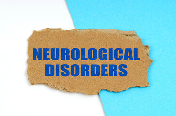 On a blue and white background lies a piece of cardboard with the inscription - Neurological Disorders