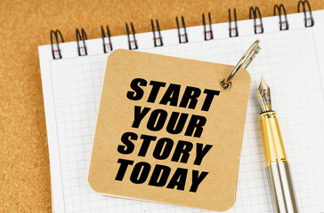There are two notebooks and a pen on the table. On the top notepad, the inscription - Start Your Story Today
