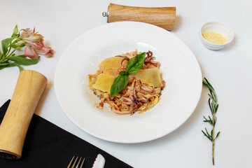 Seafood pasta and cheese on a light background. Delicious spaghetti with seafood and cheese