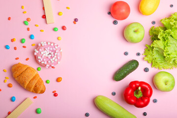 healthy foods and unhealthy foods on a colored background close-up top view.