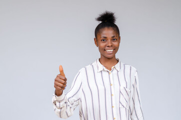 close up of beautiful african lady smiling as she did thumbs up