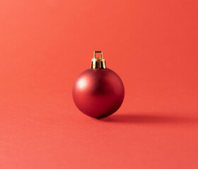 Red Christmas ball on a red background