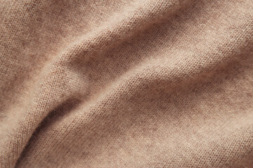 warm brown knitted natural cashmere texture as background