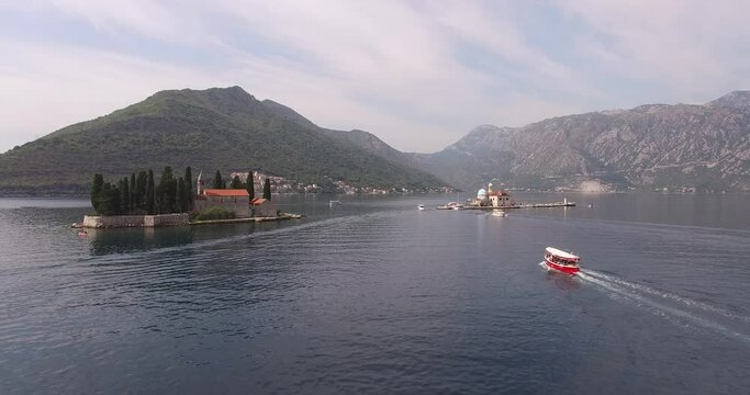 Boat sails past St. George island. Montenegro