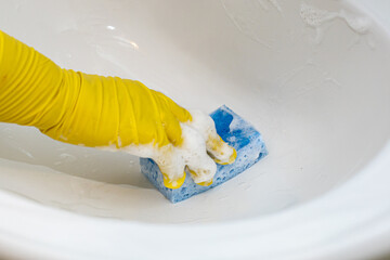 Bathroom cleaning, the process of washing the faucet with a cleaning agent.