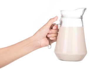 Hand holding Jug Milk ​isolated on a white background.