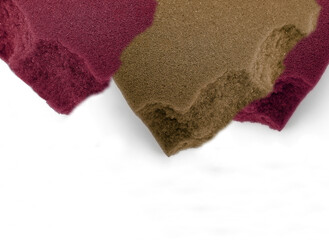 Coarse foam sponge with copy space. Cutout in brown and maroon colors isolated on a white background