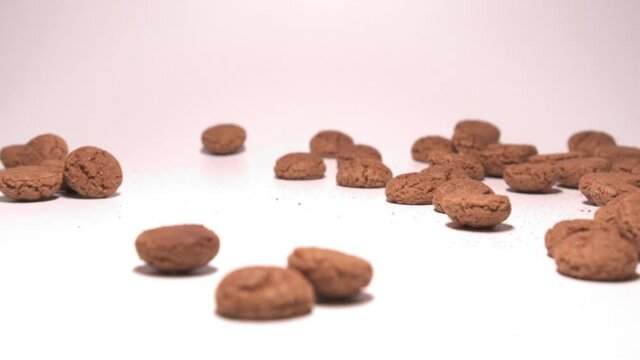 Saint Nicholas (Sinterklaas) candy on a white background. Slow motion.