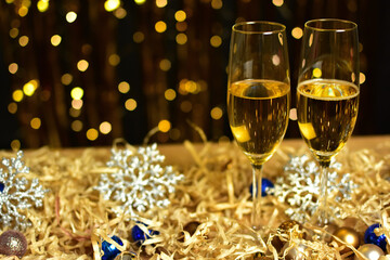 Glasses of champagne on golden background. new year and christmas celebration