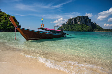 Naklejka na ściany i meble Tropical islands view with long tail boat ocean blue sea water and white sand beach, Krabi Thailand nature landscape