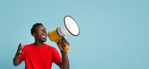 Emotional Young Black Guy Making Announcement With Megaphone In Hands