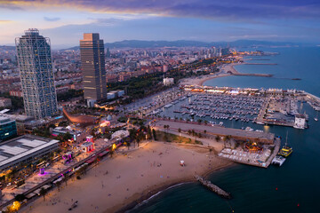 Picturesque evening aerial view of coastal area of Barcelona overlooking Olympic Harbor marina with...