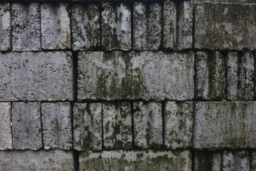 The neatly arranged bricks that will be used as the foundation of a house that looks good are used as a background