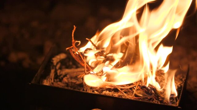 Beautiful close up shot of Backyard Bonfire burning in slow motion at night