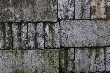 The neatly arranged bricks that will be used as the foundation of a house that looks good are used as a background