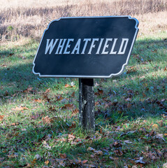 The Wheatfield sign next to it at the Gettysburg National Military Park. The Wheatfield area saw intense fighting on the second day of the battle