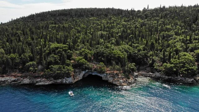 Cypresses And Olive Trees On The Rugged Ionian Sea Coast. Foki Beach In The Island Of Kefalonia In Greece. aerial