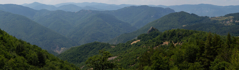 Rhodopes, are a mountain range in Southeastern Europe. Panorama. The forest area covers the mountains.