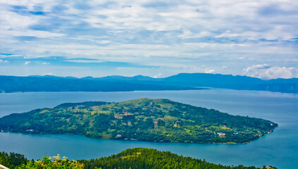 The beauty of Lake Toba which is a caldera lake comes from an ancient volcanic eruption and is the largest volcanic lake in the world. View from geosite hutaginjang. North Sumatra, Indonesia