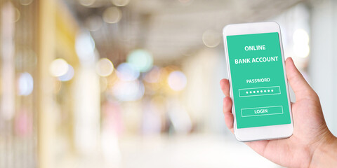 Hand using smartphone with online bank account password login on screen over blur background, online banking cyber security concept