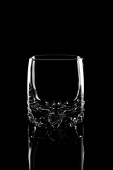 empty glass tumbler on a black background