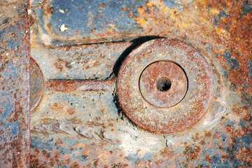 Old metal rusty jack-screw for railway carriage and wheels. Industrial tools and equipment