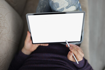 Man surfing internet on modern tablet with stylus