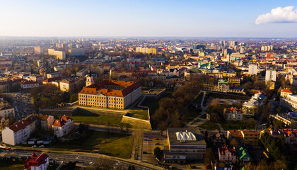 Aerial view of Renaissance building of Rzeszow castle on background of modern cityscape in springtime, Poland