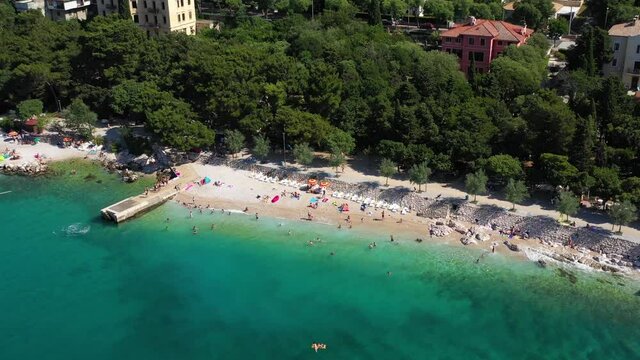 Tourists Enjoying At Scenic Crikvenica Resort Town, Kvarner Bay, Croatia - aerial drone shot