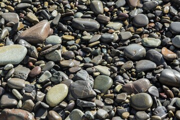 Row of pebbles stone on beach background