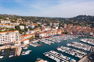 Fototapeta na wymiar Picturesque aerial view of Cassis cityscape on Mediterranean coast with marina on sunny autumn day, Southern France.