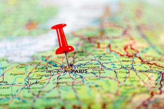 push pin pointing at Paris, France