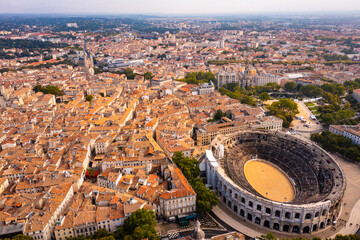 Aerial view of historical area of French city of Nimes overlooking restored antique Roman...