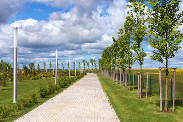 Fototapeta premium View of the pathway in the park in Gusev town in the Kaliningrad region, Russia