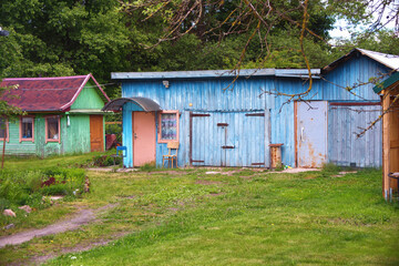 Fototapeta premium Small old wooden huts in the village