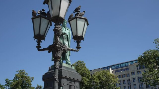 Monument to poet Alexander Pushkin on Pushkin Square in Moscow on a bright sunny day. Shooting in motion