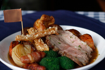 Sunday roast dinner lamb pork should with cracking meet