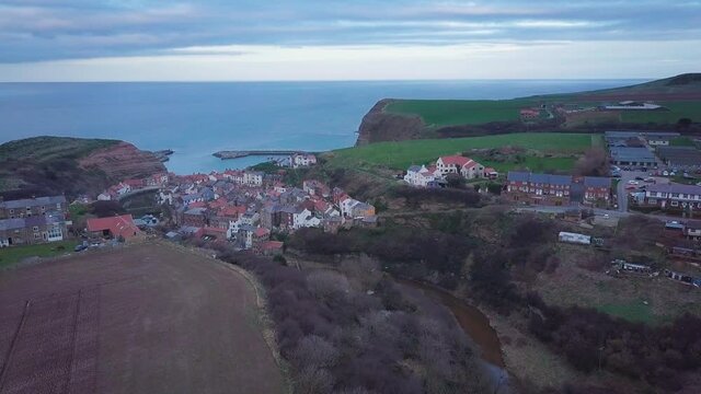 Aerial view of Staithes on the North Yorkshire coast at dusk