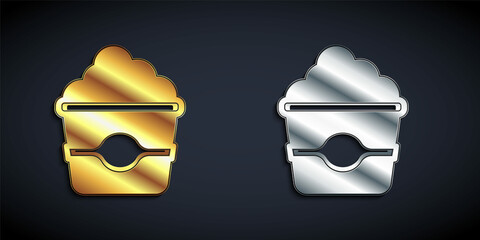 Gold and silver Popcorn in cardboard box icon isolated on black background. Popcorn bucket box. Long shadow style. Vector