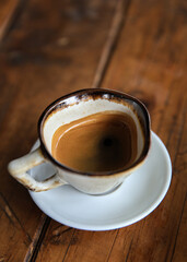cup of coffee on wooden table