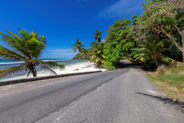 Scenic beach road in tropical island, Mahe, Seychelles.