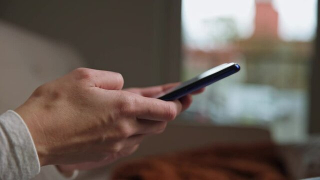 Female hands send text message to chat at smartphone application. Online social media